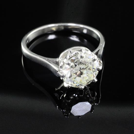 A modern platinum and solitaire diamond ring, size Q.